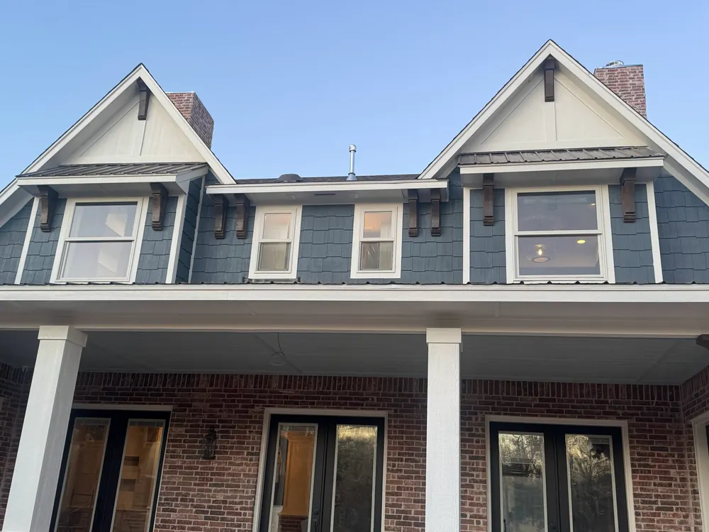 custom home dormers with finished white fascia, soffits and exterior trim